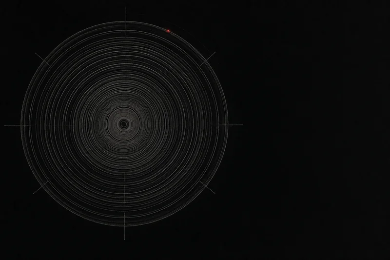 Engraved concentric circles like tree rings on a dark field, a single red point of light on the outermost ring: a study of decades measured.